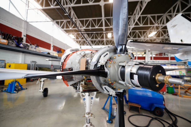 Private jet aircraft in the hangar open for regular maintenance service.