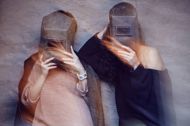 istock Two women in a welder masks. 938493370