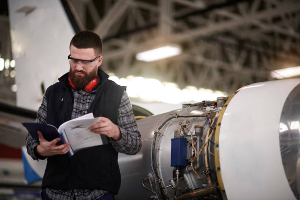 istock Aircraft mechanic in the hangar 938493440