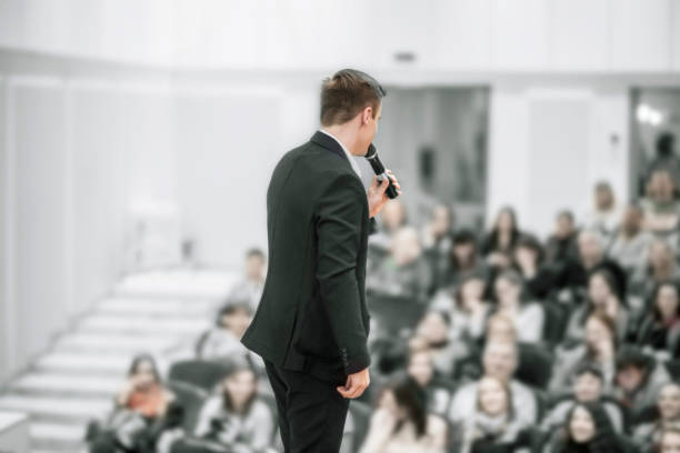 istock successful businessman holds business conference for the press 938494862