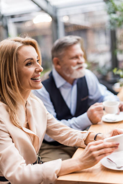 istock selective focus of couple drinking coffee on romantic date in cafe 938504980