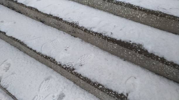 istock Stone staircase of marble / Snow on the steps / 938505822