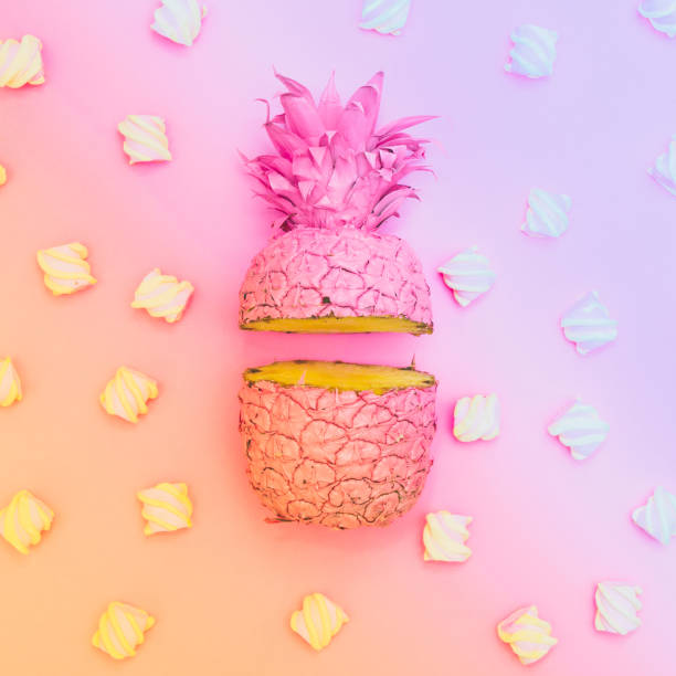 istock two painted halfs of the pineapple with marshmallow in gradient holographic 938506496