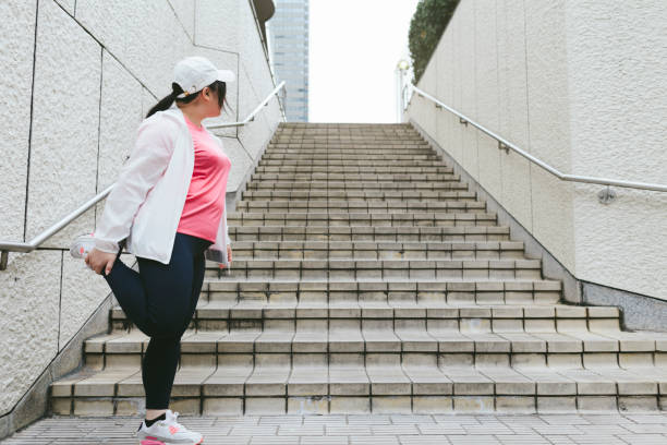 istock Woman doing stretching in city 938509336