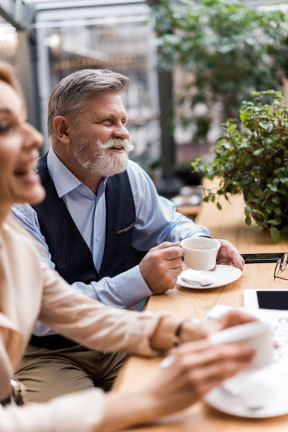 istock selective focus of couple drinking coffee on romantic date in cafe 938511550