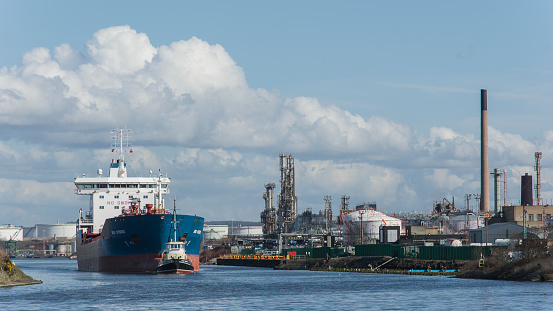 Sunday 25 March 2019:  Liverpool Ellesmere Port UK.  The Chemical/Oil transport ship leave the dock at Stanlow oil refinery.  The ship is slowly pulled along by a tug boat to the wider estuary of the River Mersey.