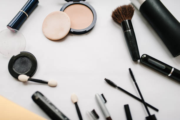 istock Various set makeup products: brushes, eyeshadow, powder, mascara, cosmetics isolated on light white background. copy space, flat lay, collage, frame. top view. 938520760