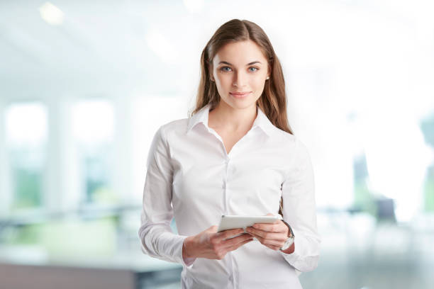 istock Professional young woman with digital tablet 938524210
