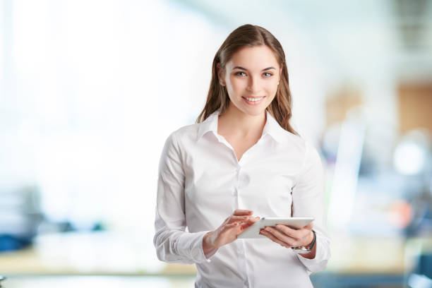 istock Professional young woman with digital tablet 938524214