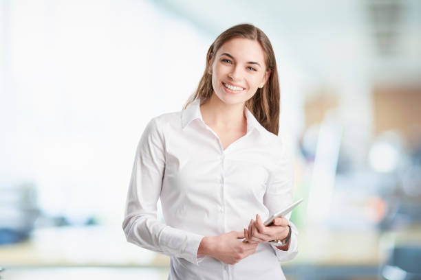 istock Professional young woman with digital tablet 938524218