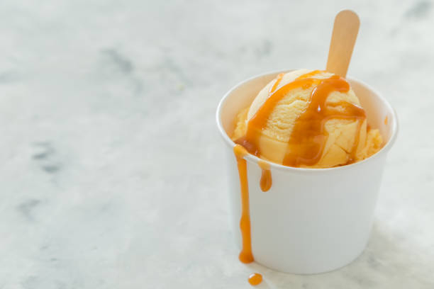 istock Caramel ice cream in paper cone 938524432