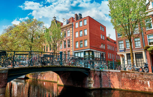 istock Bridge over channel in Amsterdam Netherlands houses river Amstel 938524918