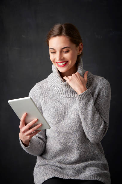 istock Young woman with digital tablet 938525062