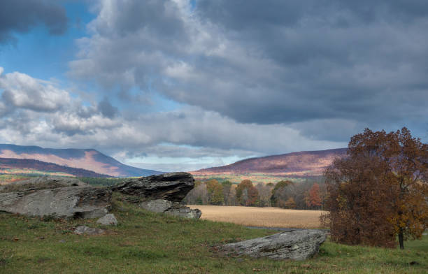 istock sunny country landscape with rock outcrop 938527454
