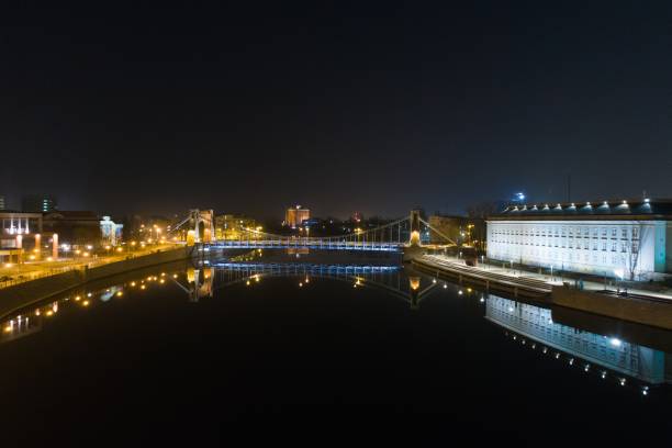 istock Aerial night drone view on Grunwald Bridge over Odre river in Wroclaw 938527656