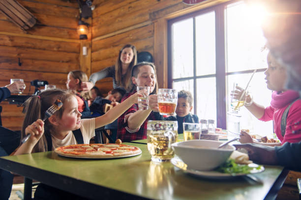 Families in a ski resort, apres-ski relaxing