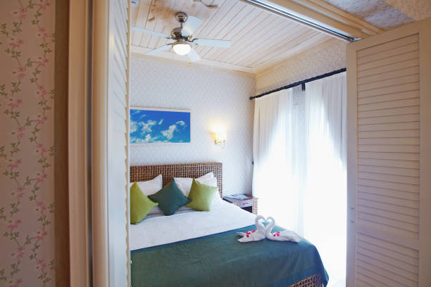 istock Cozy small hotel bedroom decorated for guests 938532372