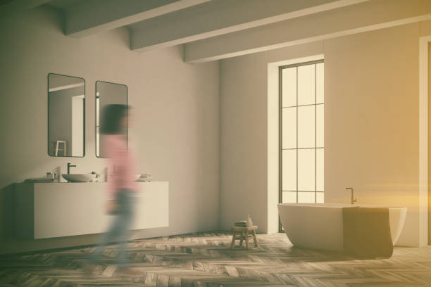 istock Corner of a white bathroom with wood floor toned 938535504