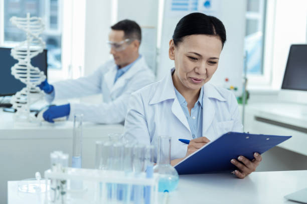 istock Joyful researchers working in the lab 938536114