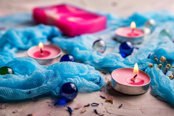 istock Romantic background with candles, soap and shawl 938543016