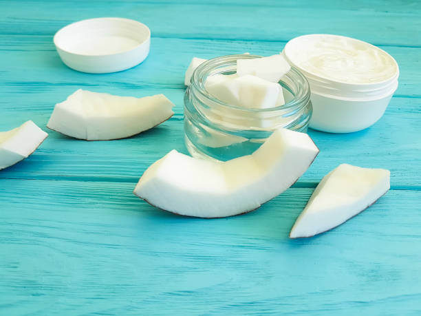 istock cream cosmetic coconut on blue wooden 938546740