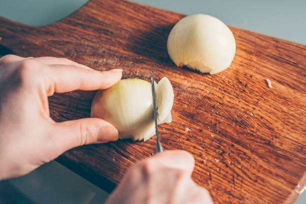 istock The cook shreds a bow, a first person view 938547050