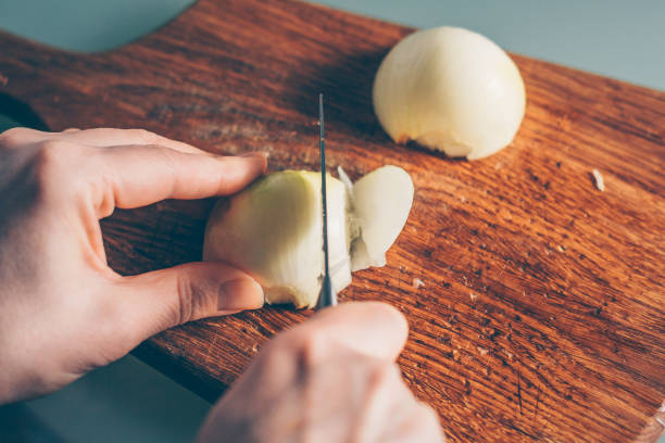 istock The cook shreds a bow, a first person view 938547274
