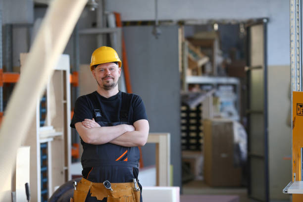 istock Portrait of young attractive man in work clothes 938547362