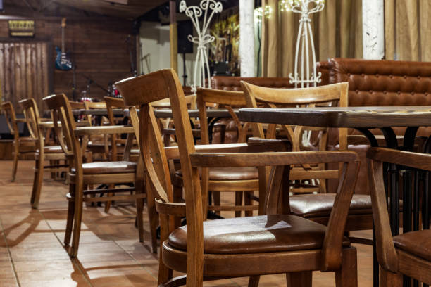 istock empty wooden chairs at the tables in the restaurant 938547506