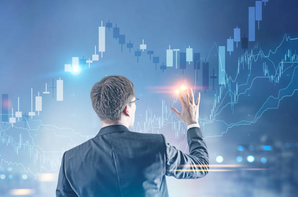 istock Young businessman, HUD ands graph 938549288