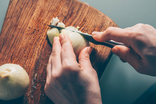 istock The cook cuts the onion on a cutting board 938549848