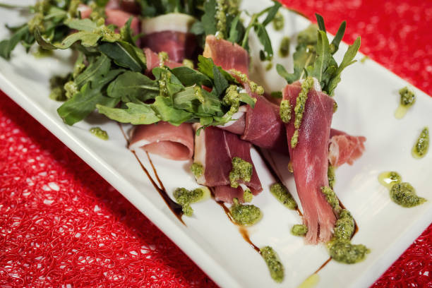 istock twisted bacon served with rucola and pesto sauce in restourant 938554880