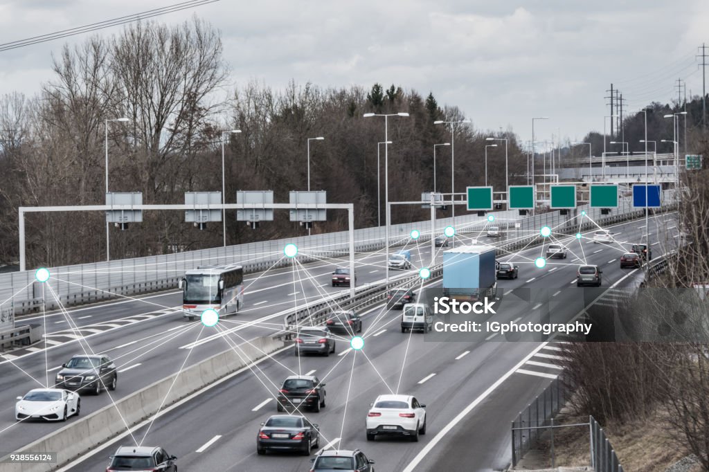 Autonomous Cars on Road Illustration and photo of a autonomous self-driving cars driving on a highway. The cars are connected through wireless technology and artificial intelligence which enables them to drive on the road safely. Mode of Transport Stock Photo