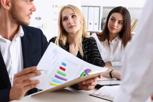 istock Group of people hold silver pen ready to make 938556260