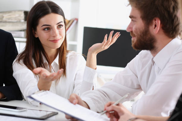 istock Group of people deliberate on white board 938556310