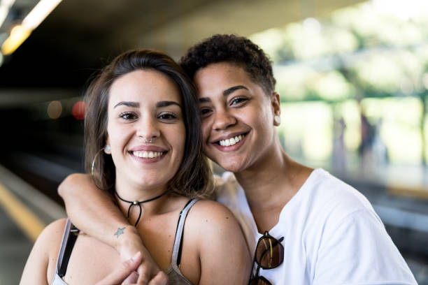 Portrait of Young Lesbian Couple at Subway Station lesbian stock pictures, royalty-free photos & images