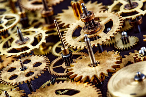 istock Close up old mechanism on a black background 938561456