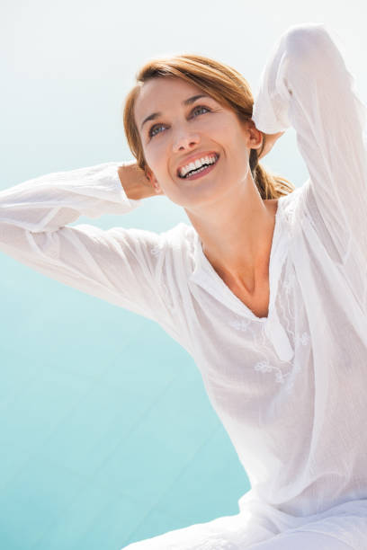 istock laughing woman in summer 938569634