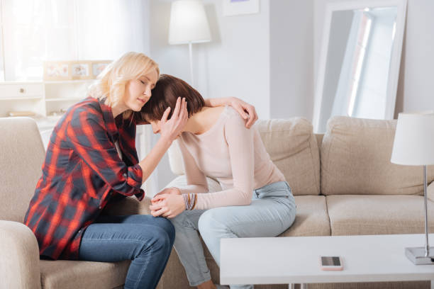 istock Pleasant blonde woman supporting her girlfriend 938573660