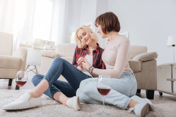 istock Joyful delighted woman enjoying wine 938575116