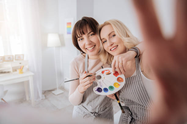istock Positive young woman holding a camera 938578650