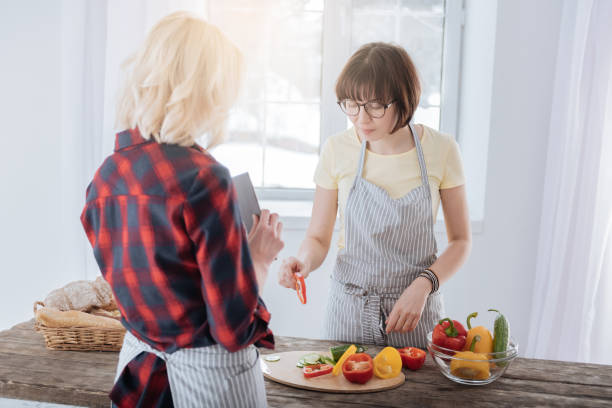istock Pleasant nice woman preparing healthy dinner 938581456