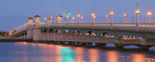 Bridge of Lions - St. Augustine - Florida The Bridge of Lions (c. 1927) in St. Augustine, Florida - known as "The Most Beautiful Bridge in Dixie” - is a drawbridge spanning the Matanzas River between downtown St. Augustine and Anastasia Island. Listed on the National Register of Historic Places, It has been a symbol of the nation's oldest city. bridge of lions stock pictures, royalty-free photos & images