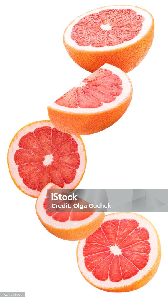 Slices grapefruit flying in the air Slices grapefruit flying in the air isolated on white background. Clipping Path. Full depth of field. Grapefruit Stock Photo