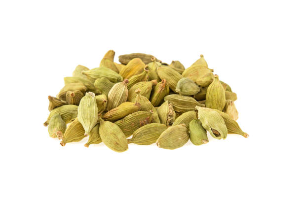 istock green cardamom pods on white background 938592606