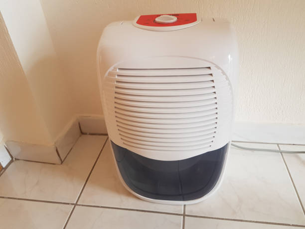 istock dehumidifier  in the room on the floor white red plastic 938593614