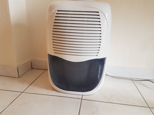 istock dehumidifier  in the room on the floor white red plastic 938593682