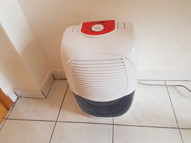 istock dehumidifier  in the room on the floor white red plastic 938593754