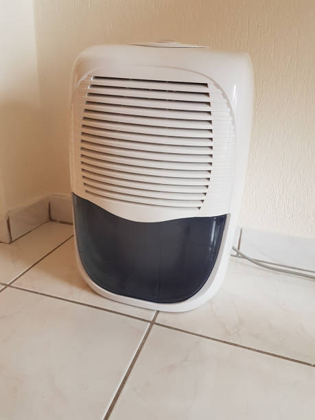 istock dehumidifier  in the room on the floor white red plastic 938593812
