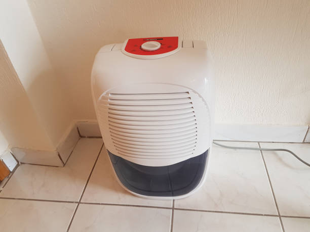istock dehumidifier  in the room on the floor white red plastic 938594662